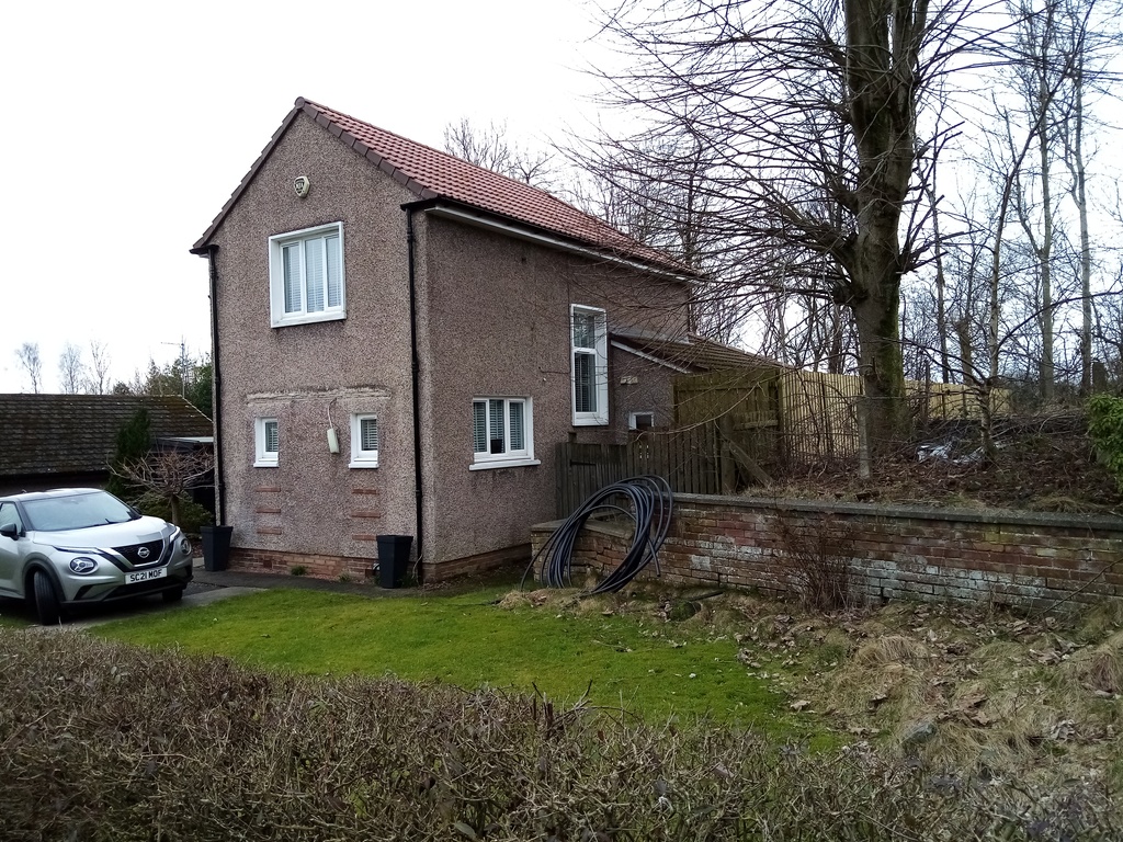narrow gable end of an l-shaped house