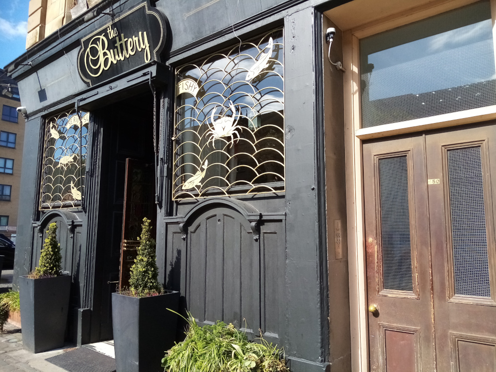 restaurant and entrance to tenement close