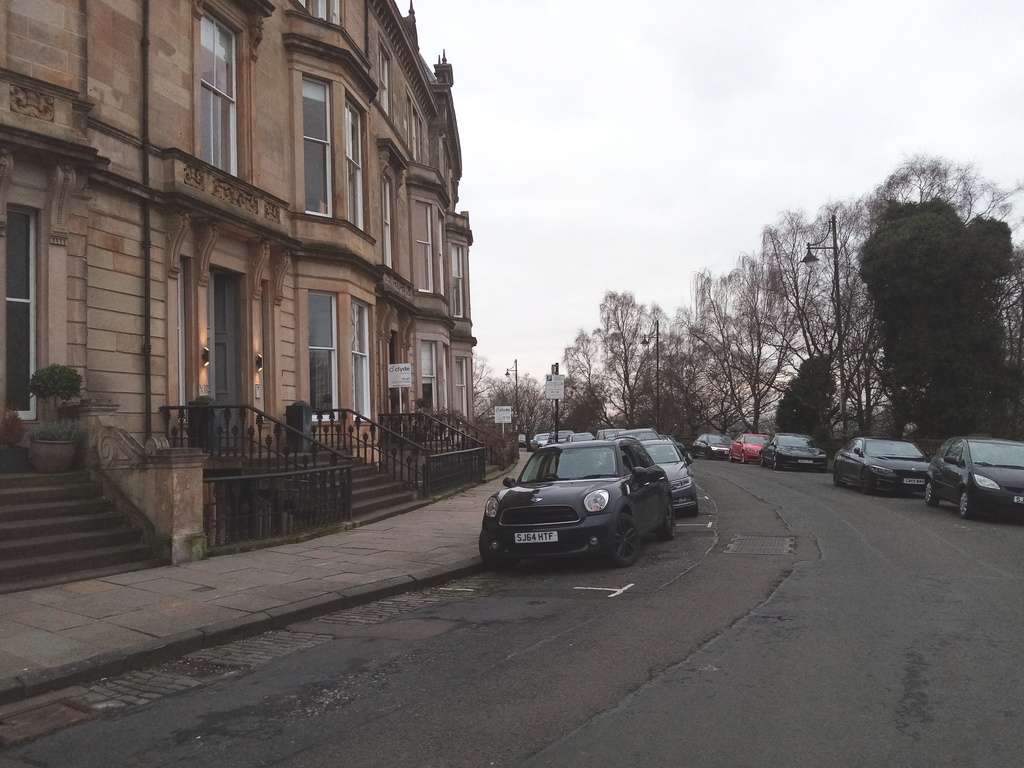a terrace of grand houses set back from the road